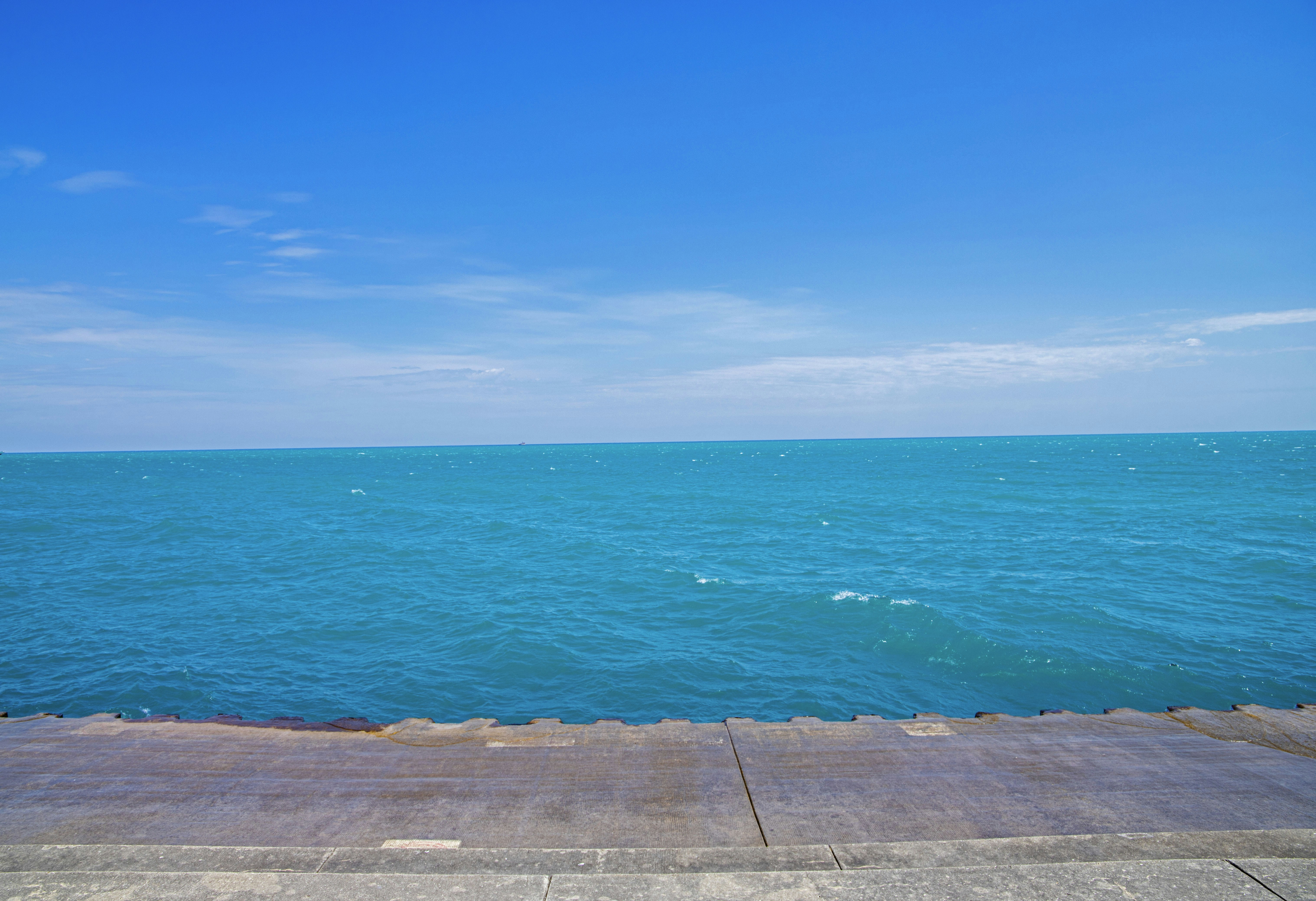 a view of the ocean from a pier, 