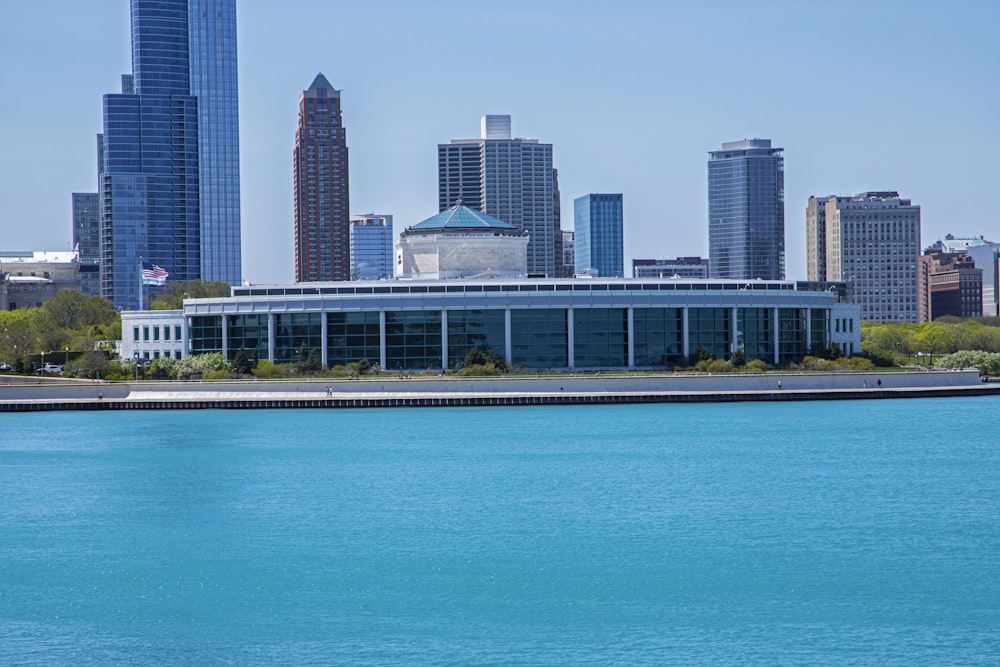 a large body of water with a city in the background