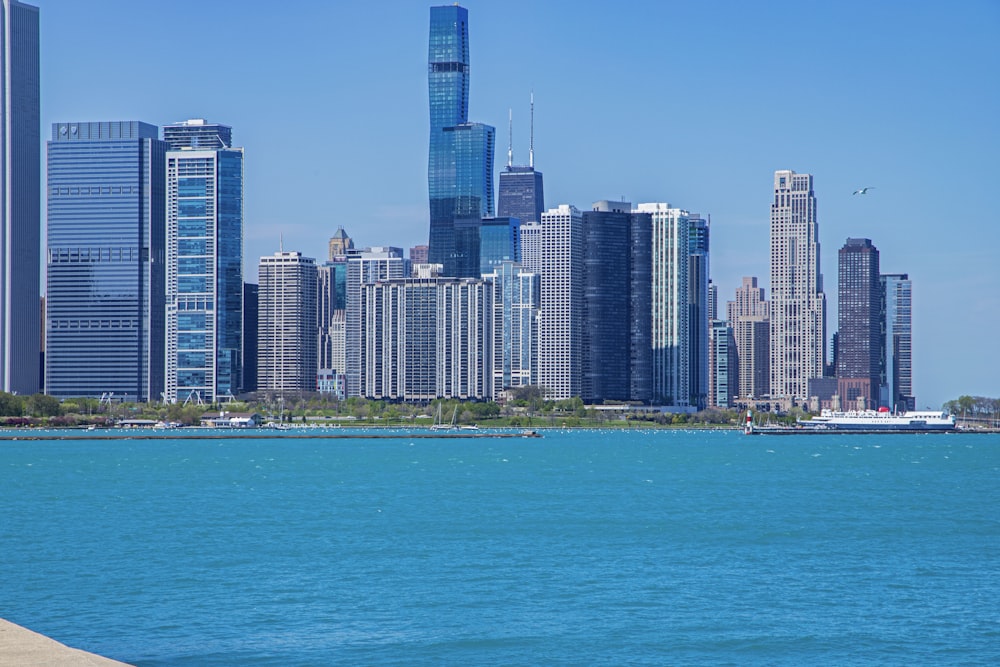 a large body of water with a city in the background