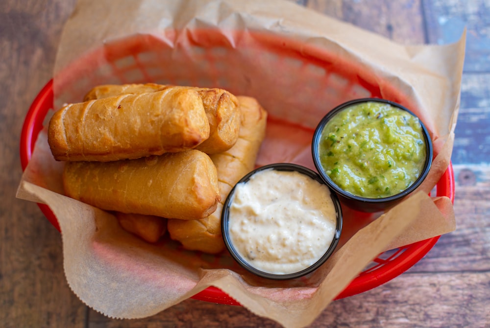 a basket filled with food on top of a wooden table