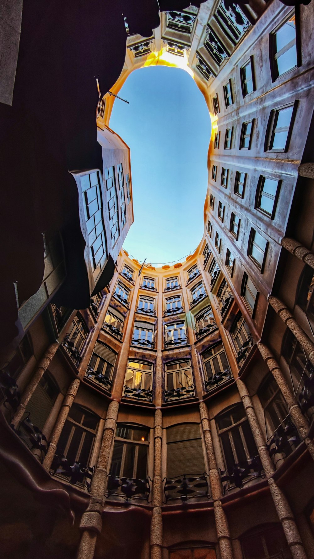 a very tall building with many windows and a skylight