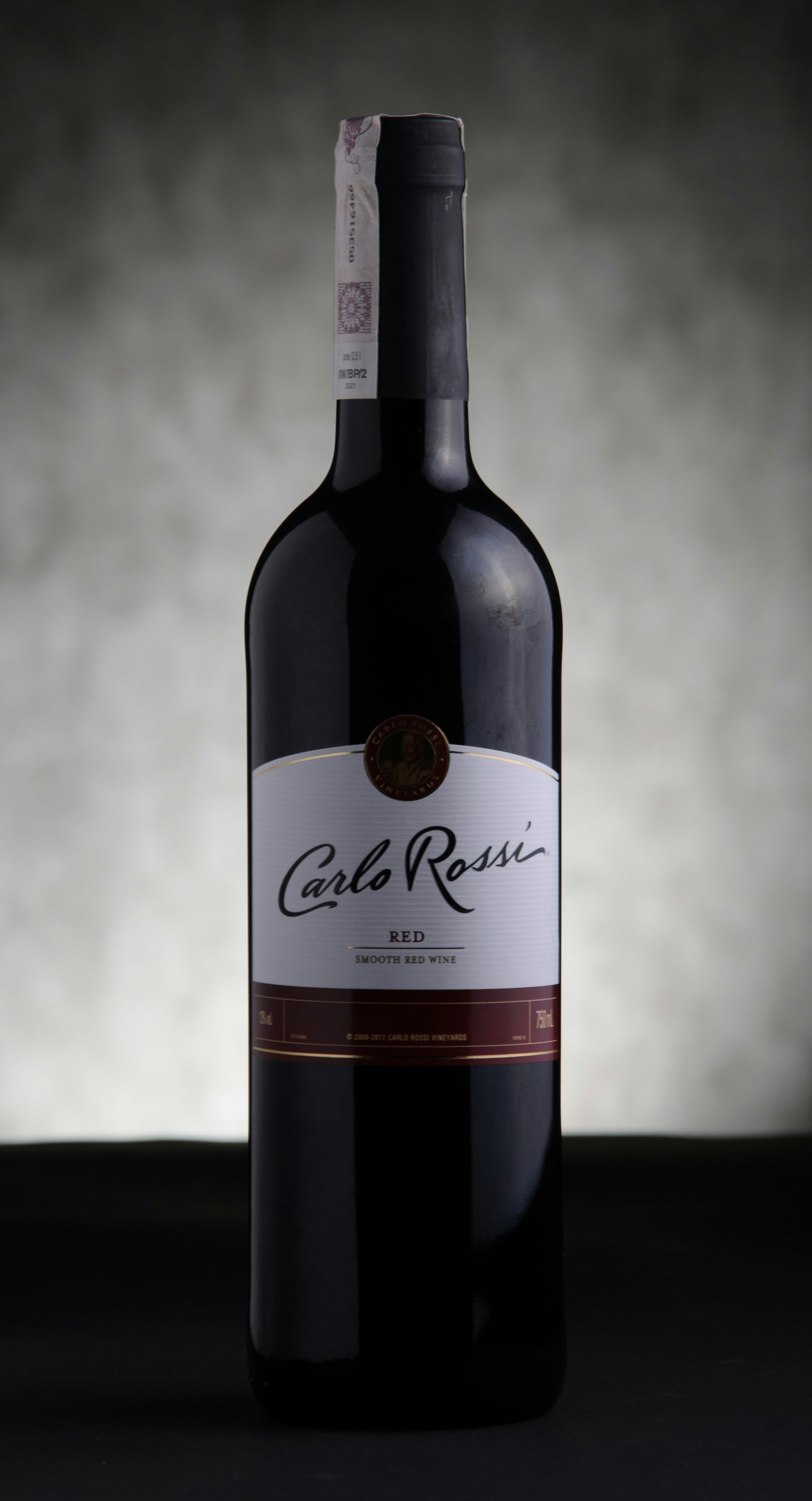 a close up of a bottle of wine on a table