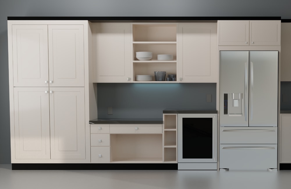 a kitchen with white cabinets and black counter tops