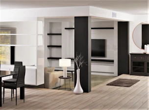a living room with a table, chairs and a television