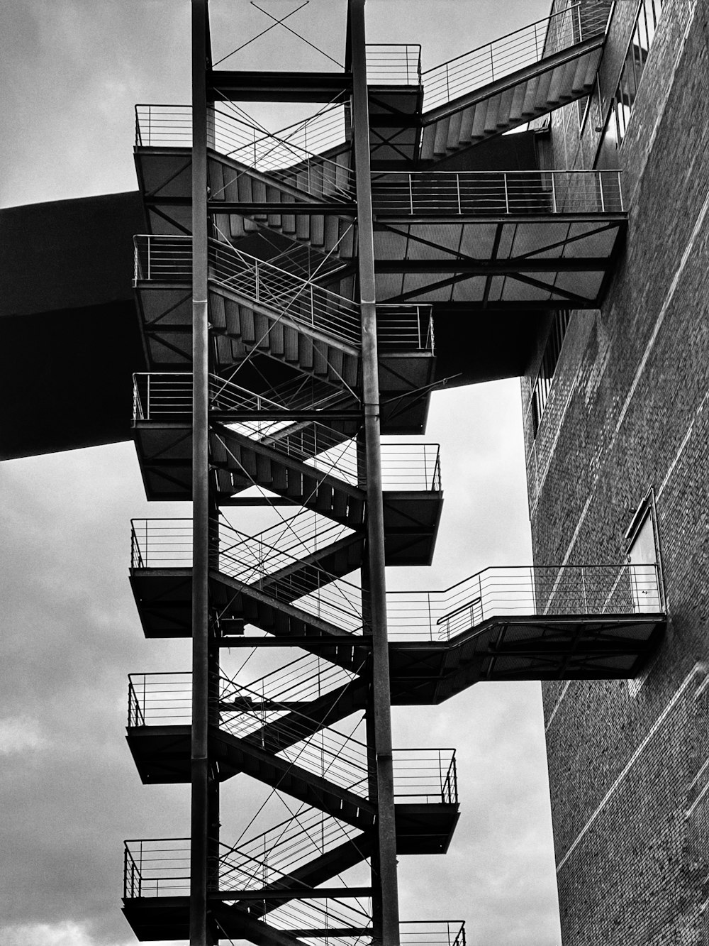 a black and white photo of a fire escape