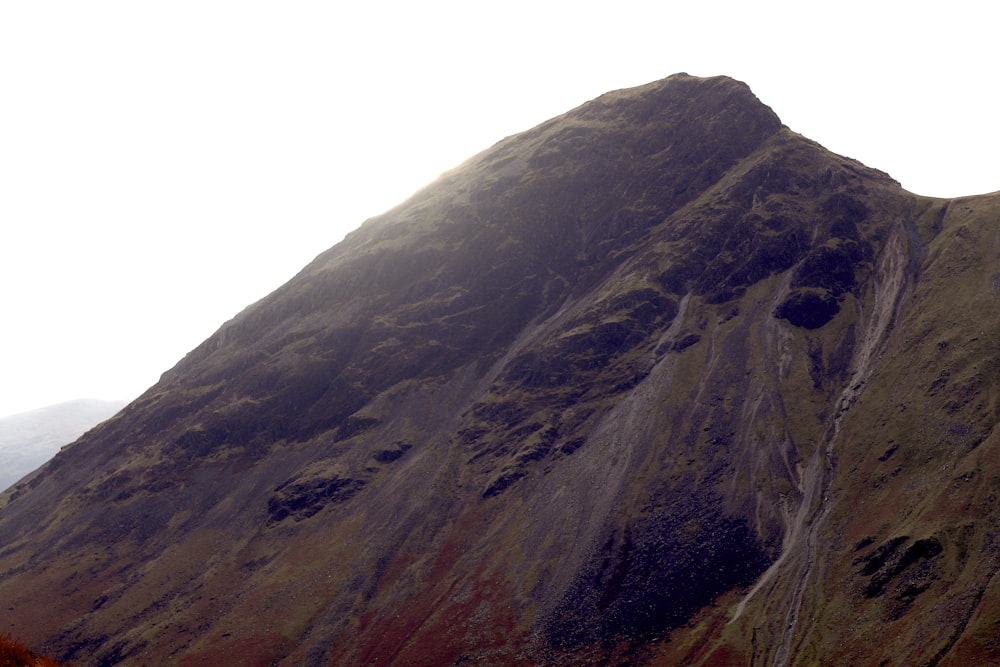 a very tall mountain with a sky background