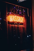 a neon sign that says massage on it