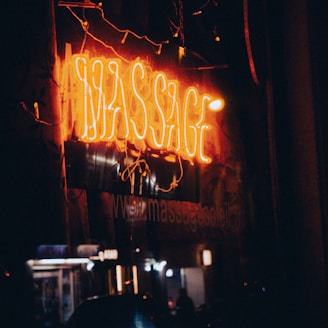 a neon sign on the side of a building