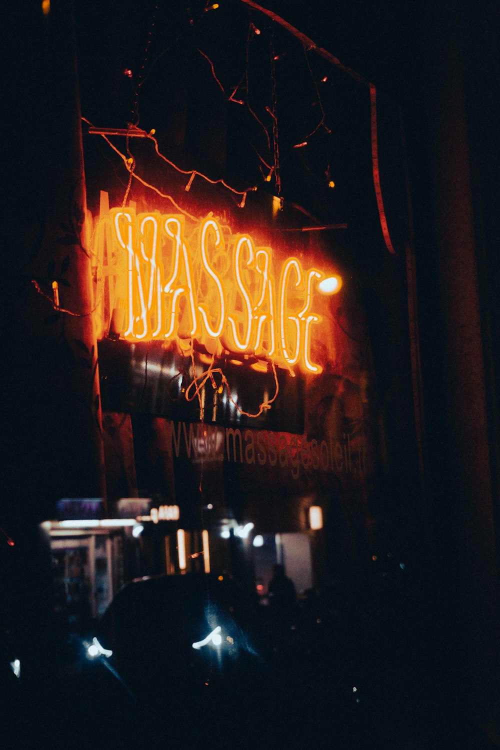 a neon sign on the side of a building