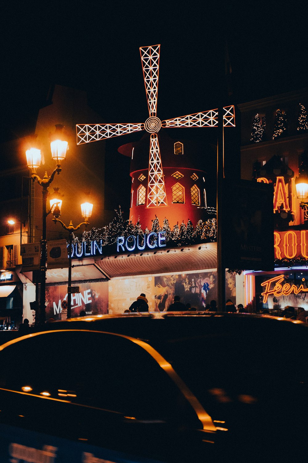 a cross lit up on the side of a building