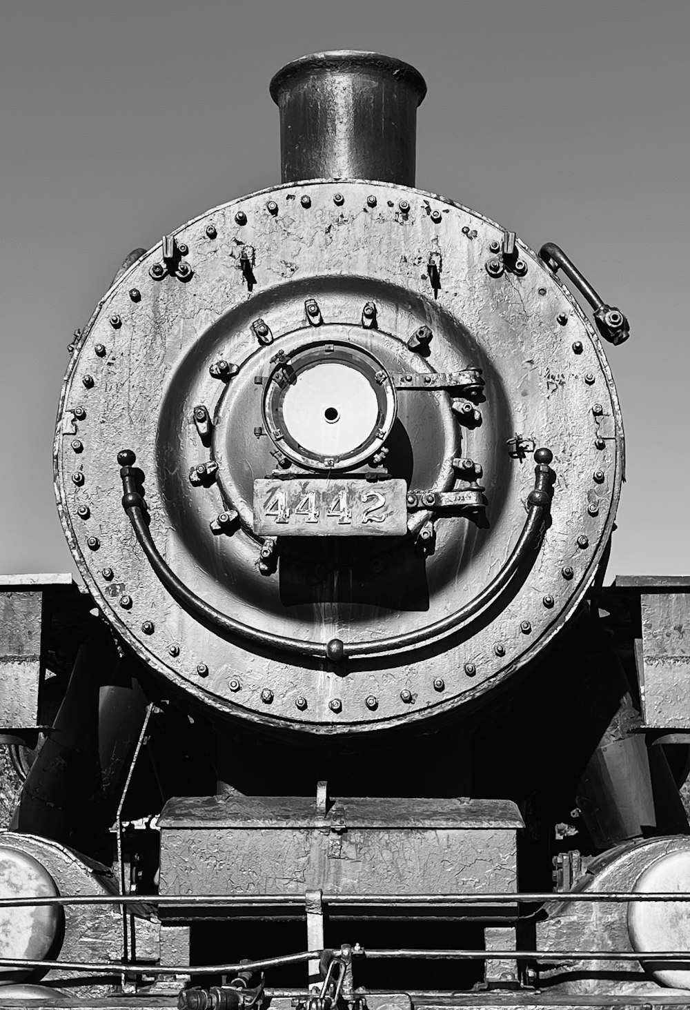 a black and white photo of a train engine