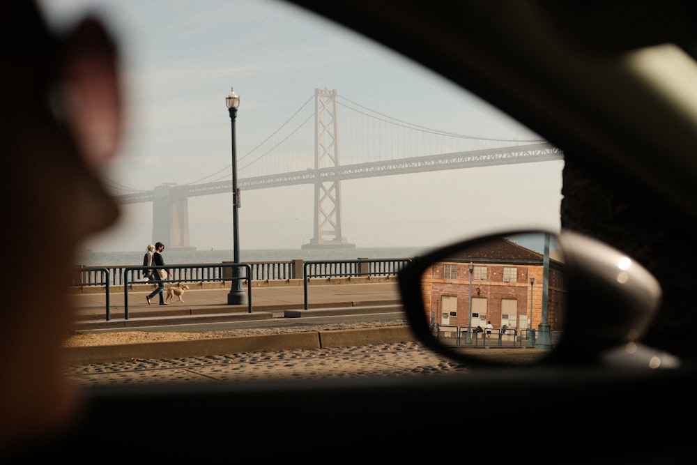 a view of a bridge from inside a car