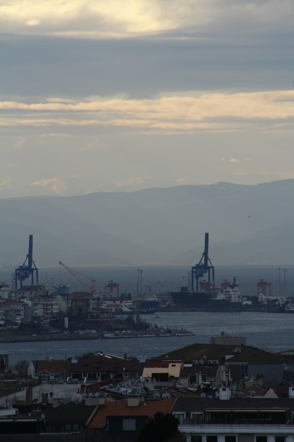 a view of a harbor with ships in the distance