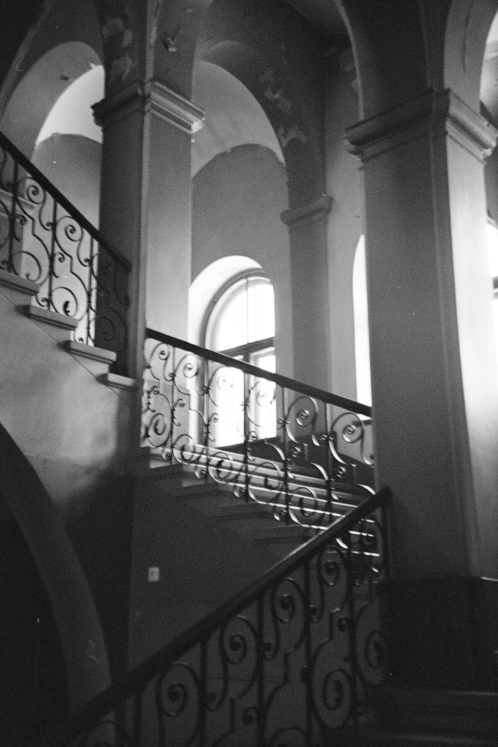 a black and white photo of a stair case