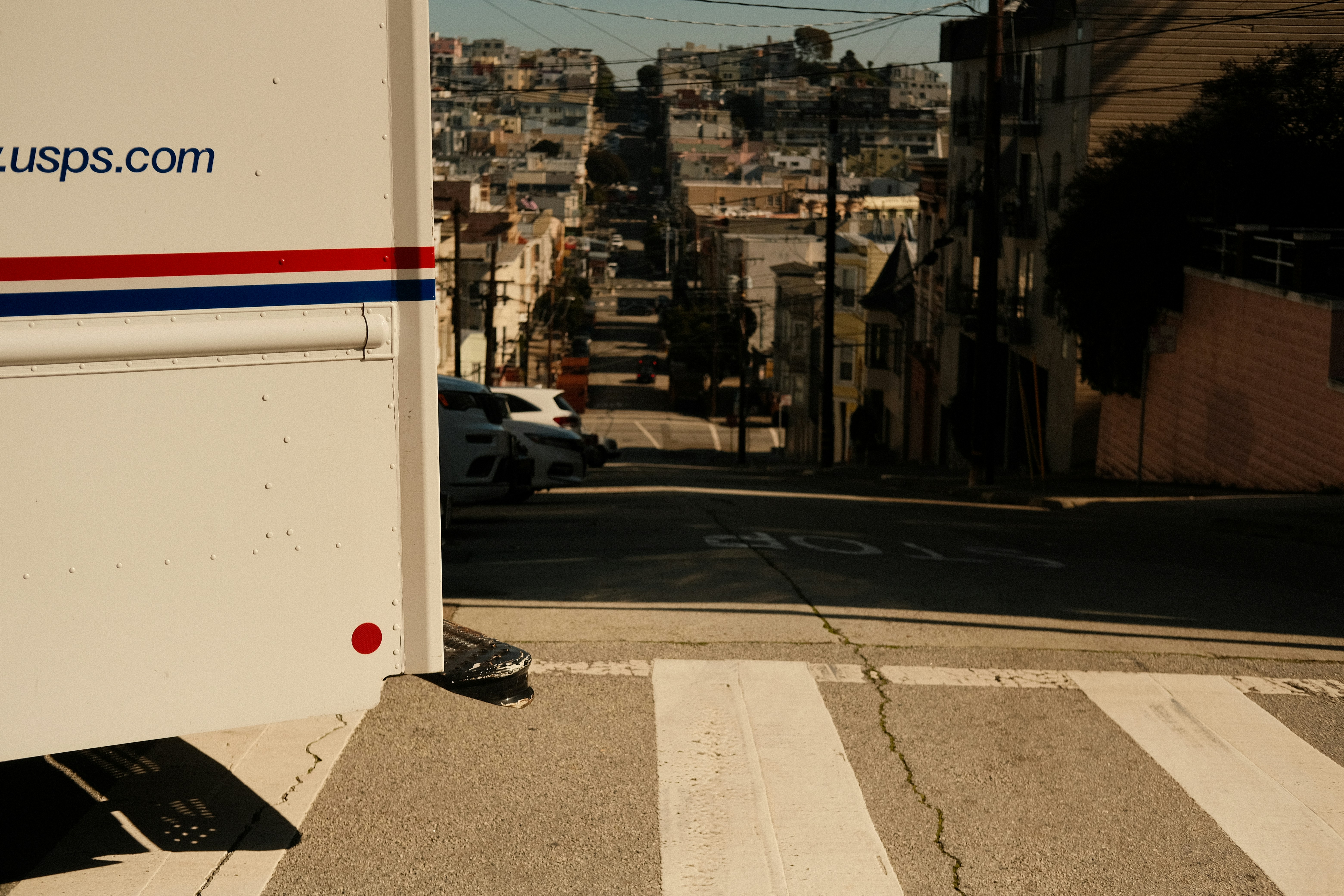 a white trailer parked on the side of a road