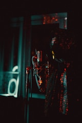 a person with a microphone in a dark room