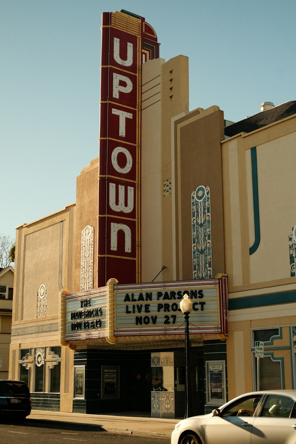 a car parked in front of a theater