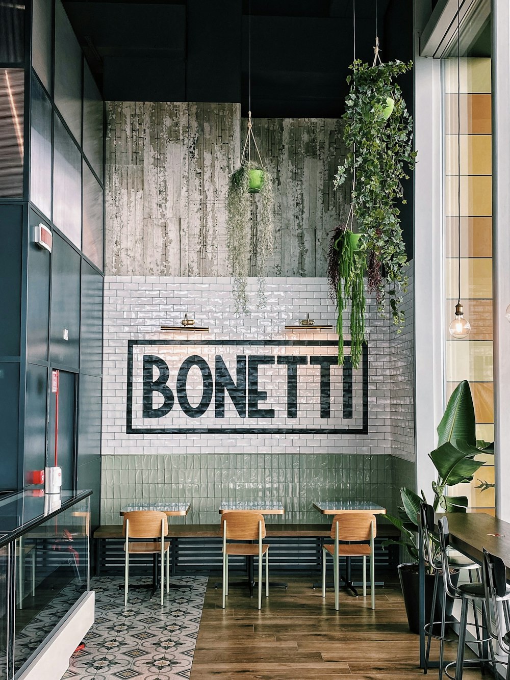 a restaurant with a sign on the wall that says bonetti
