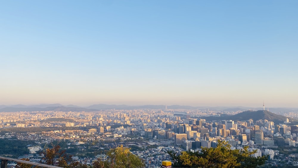 a view of a city from the top of a hill