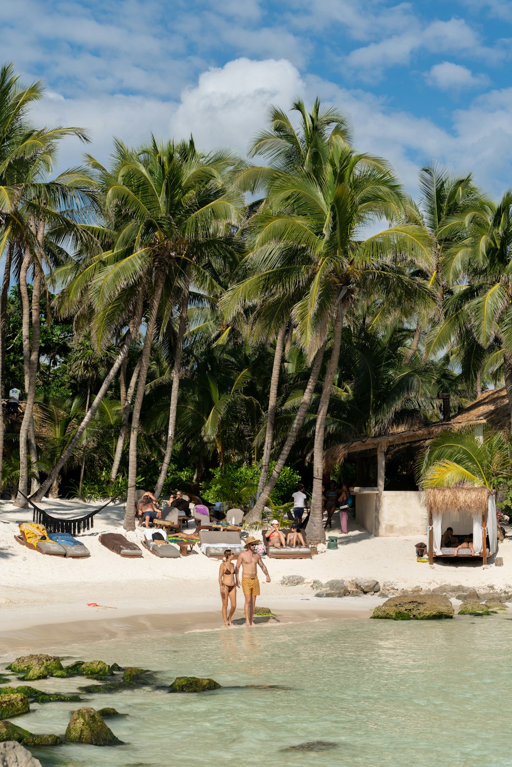 a couple of people that are standing in the water