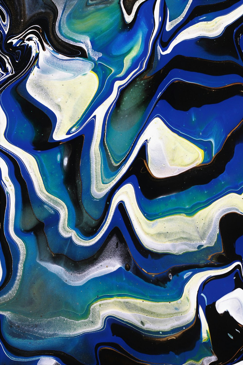 a close up of a blue and white marble