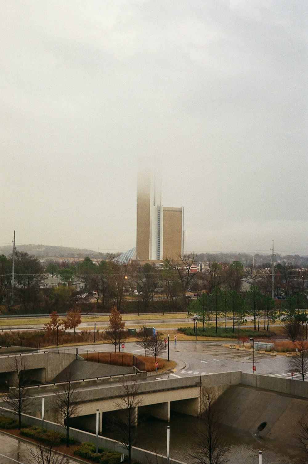 a view of a parking lot with a building in the background