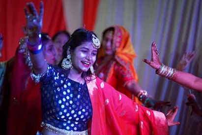 a woman in a blue and red outfit dancing