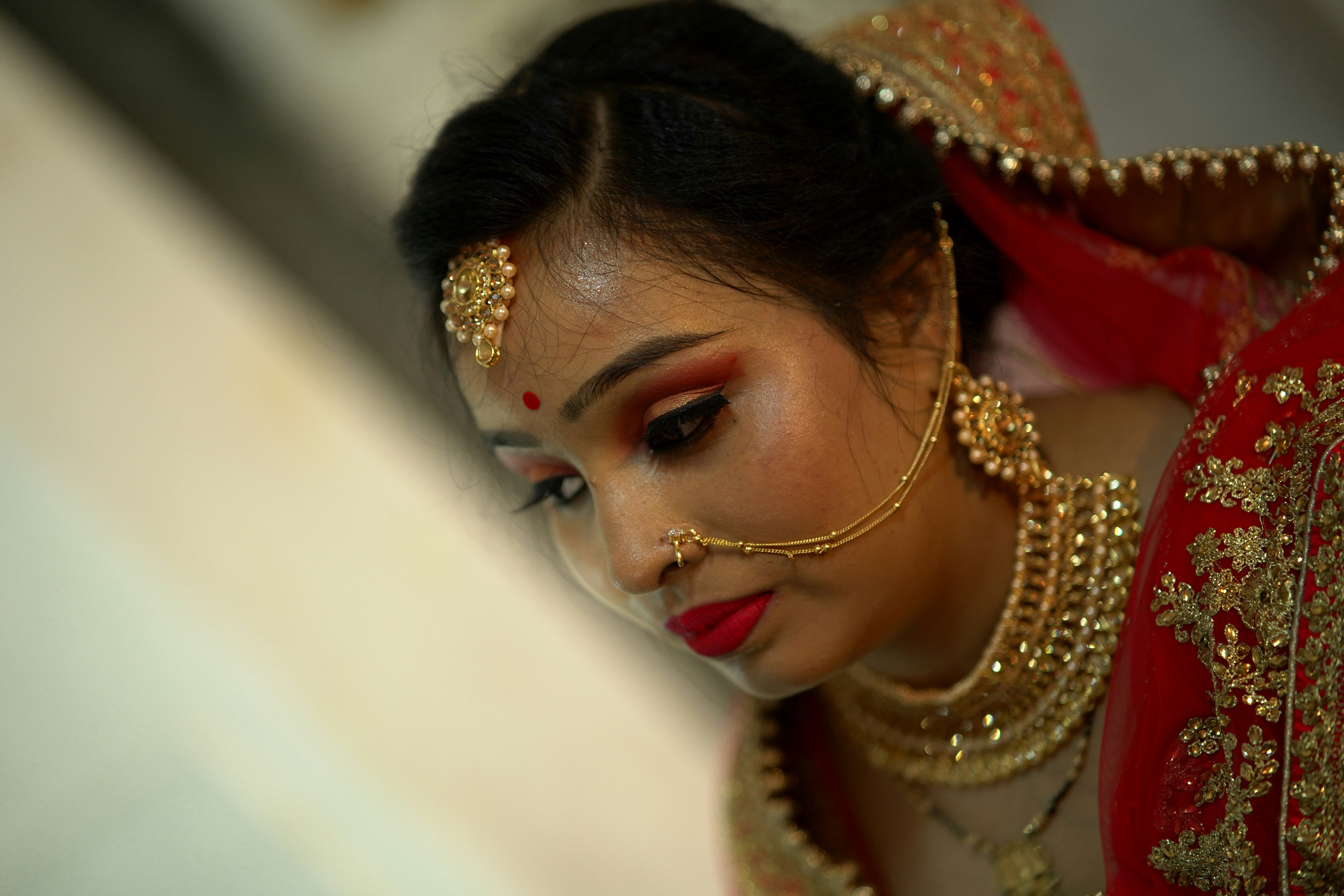 a woman in a red and gold outfit
