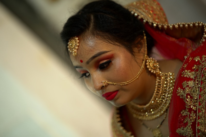 a woman in a red and gold outfit