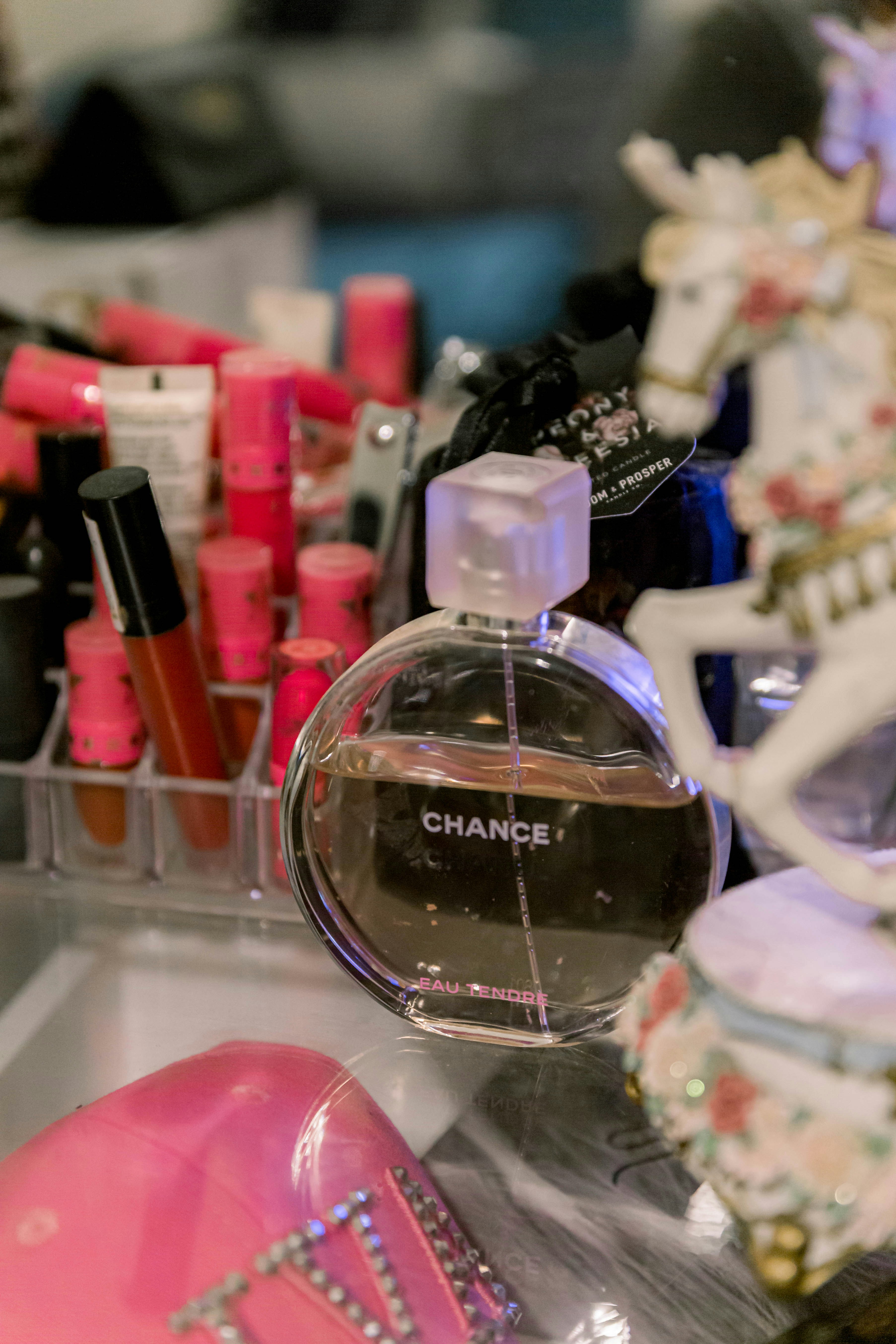 a close up of a bottle of perfume on a table