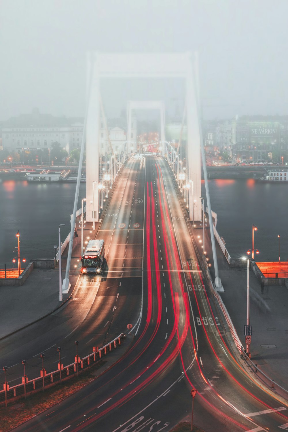 a long exposure of traffic on a bridge at night