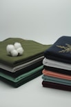 Rongzhiyue: a stack of folded cloths with a cotton ball on top
