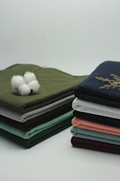 Comfortable cotton pajamas folded neatly on a wooden surface