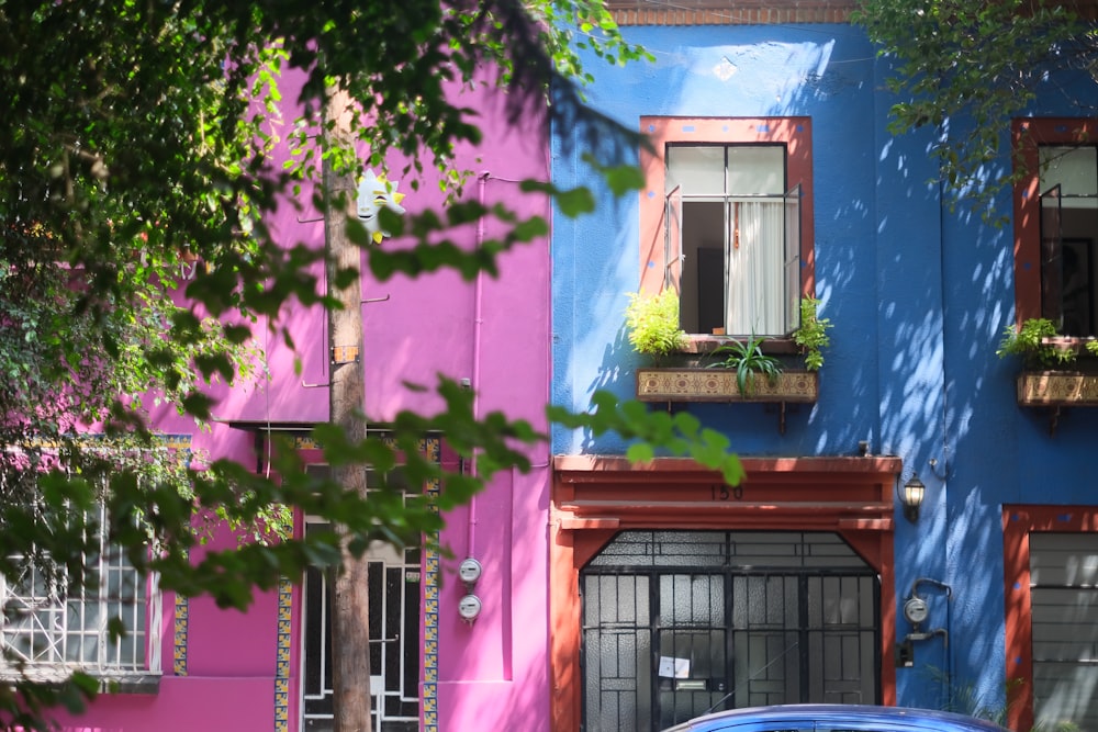 a car parked in front of a multi - colored building