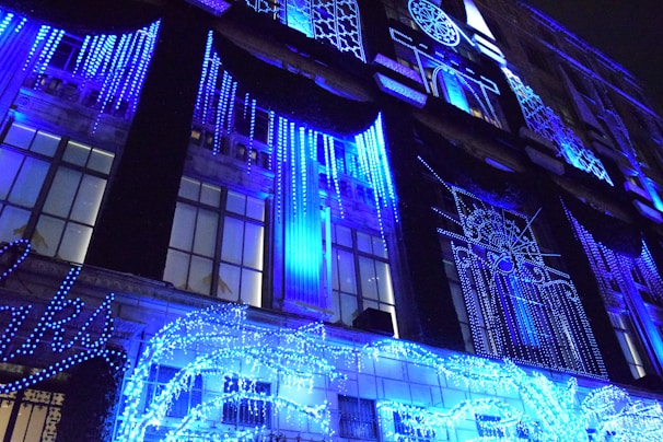 Festive facade decorated with a mix of LED snowflakes and shooting stars