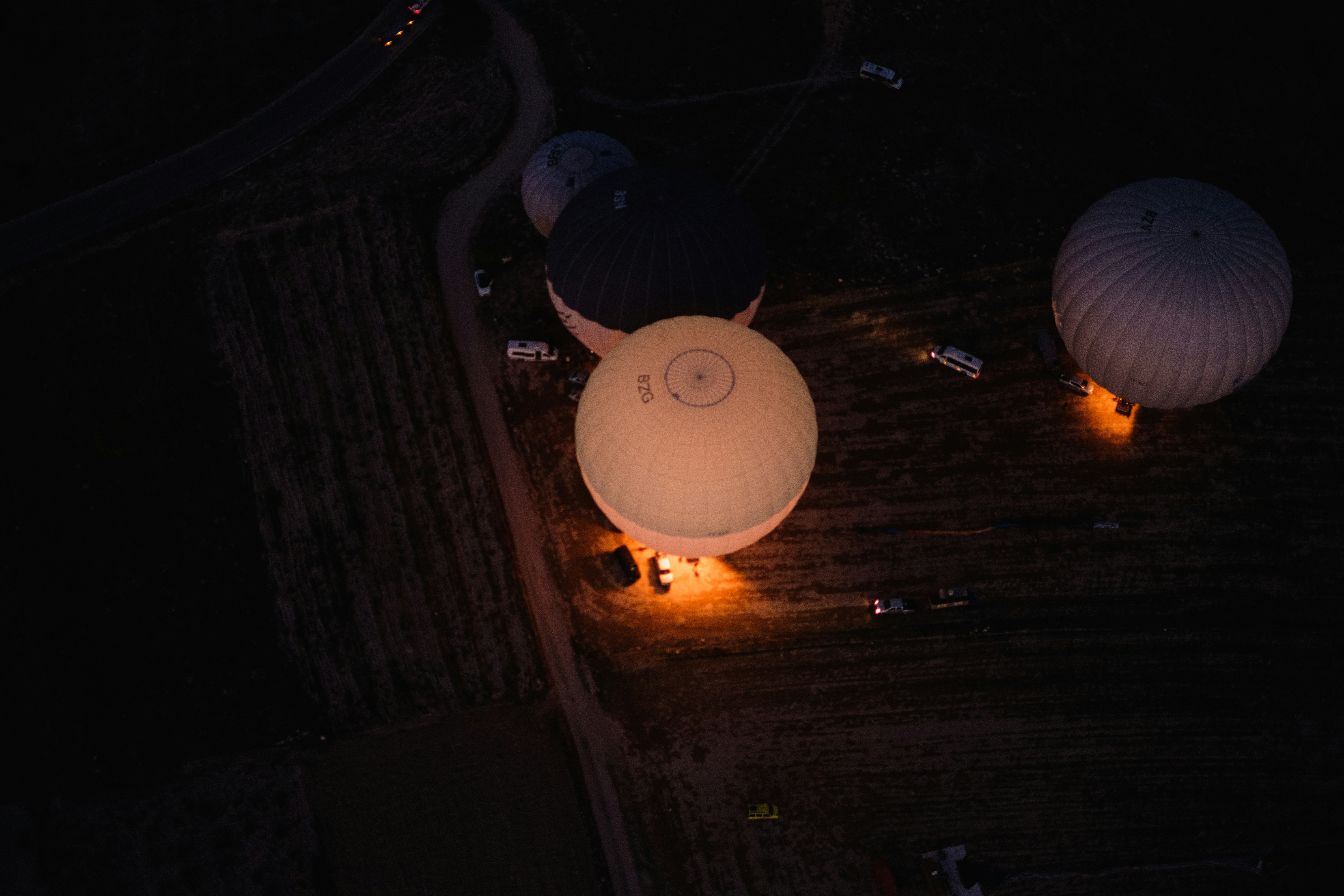 a group of balloons lit up in the dark