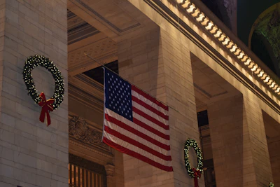 The post’s exterior decorated with red, white, and blue bunting on a festive day.