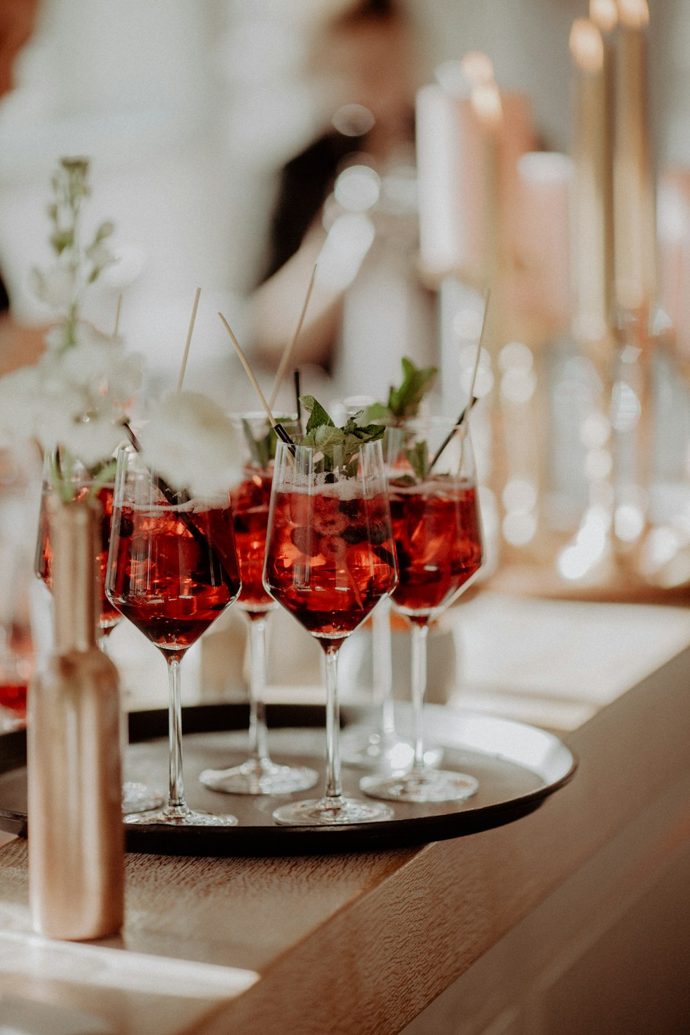 four glasses of red wine on a table