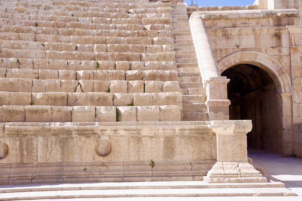 a stone structure with steps leading up to it