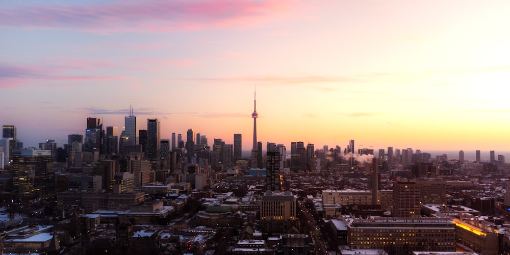 a view of a city at sunset from the top of a building