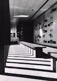 Calm and spacious memorial area with subtle shadows and fine lines creating a tranquil atmosphere.
