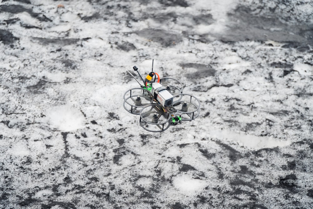 an aerial view of a remote controlled device in the snow