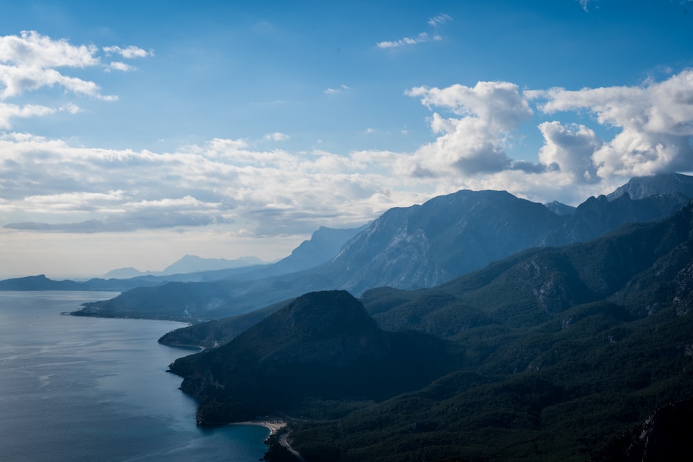 a scenic view of mountains and a body of water