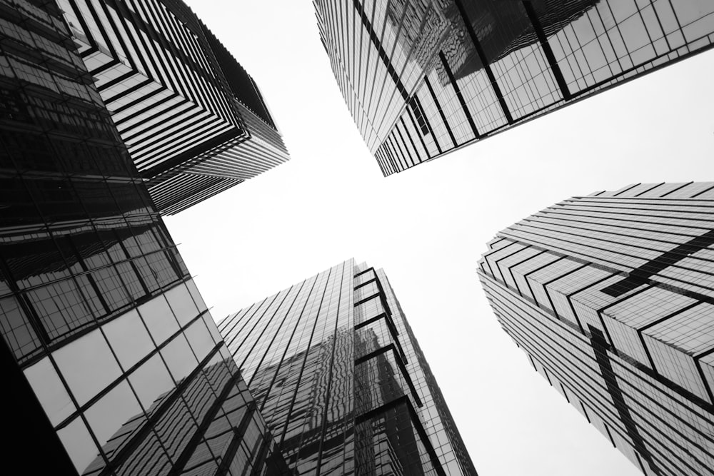 a black and white photo of tall buildings