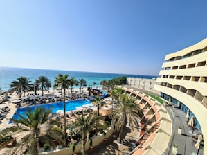 a view of a beach from a hotel room