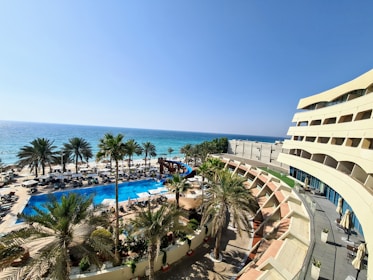 a view of a beach from a hotel room