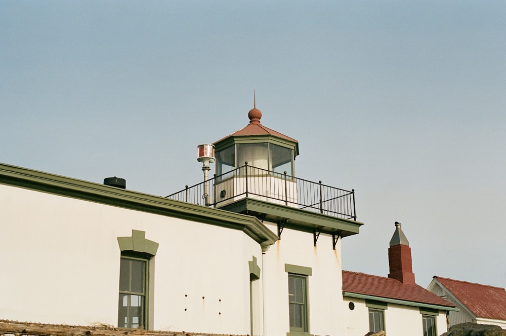 a lighthouse on top of a white building