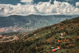 a scenic view of a valley and mountains