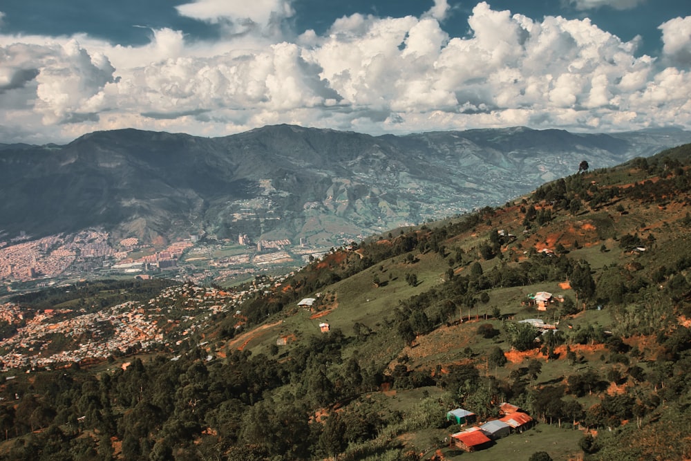 a scenic view of a valley and mountains