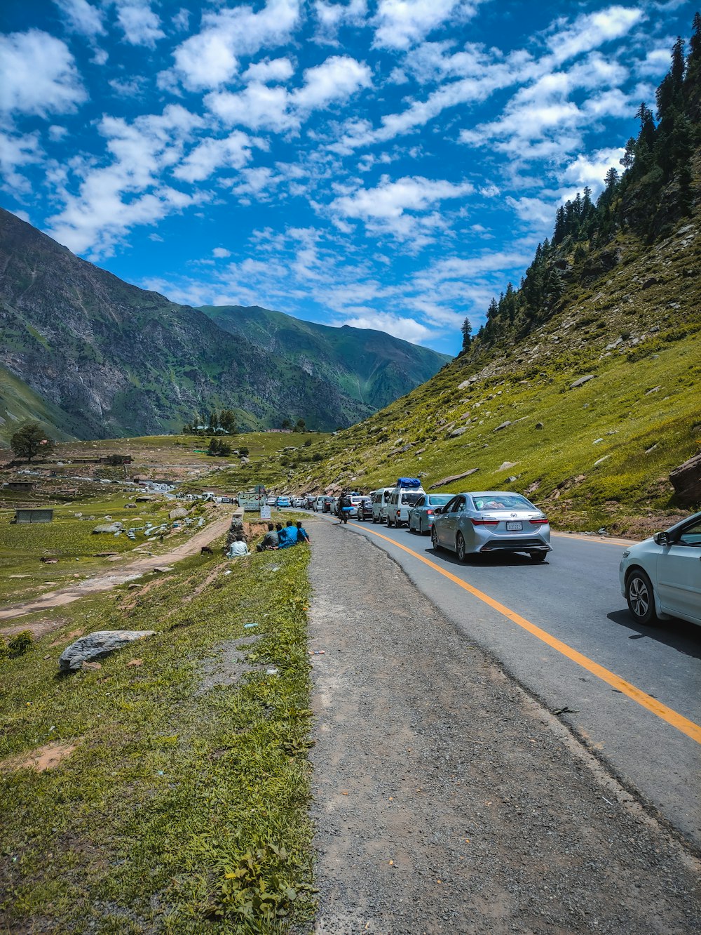 a group of cars parked on the side of a road